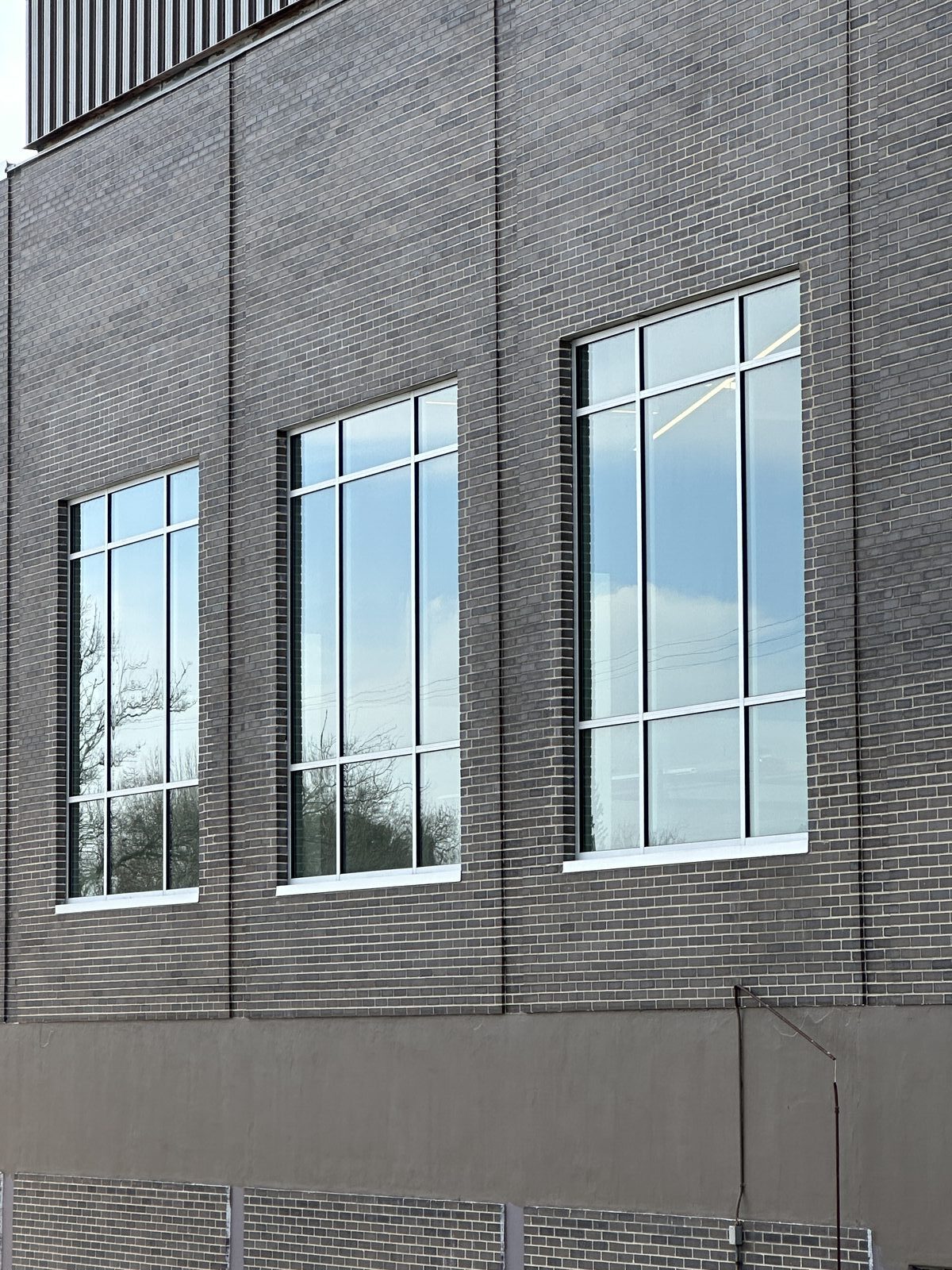 Commercial building with large glass window installations West Michigan
