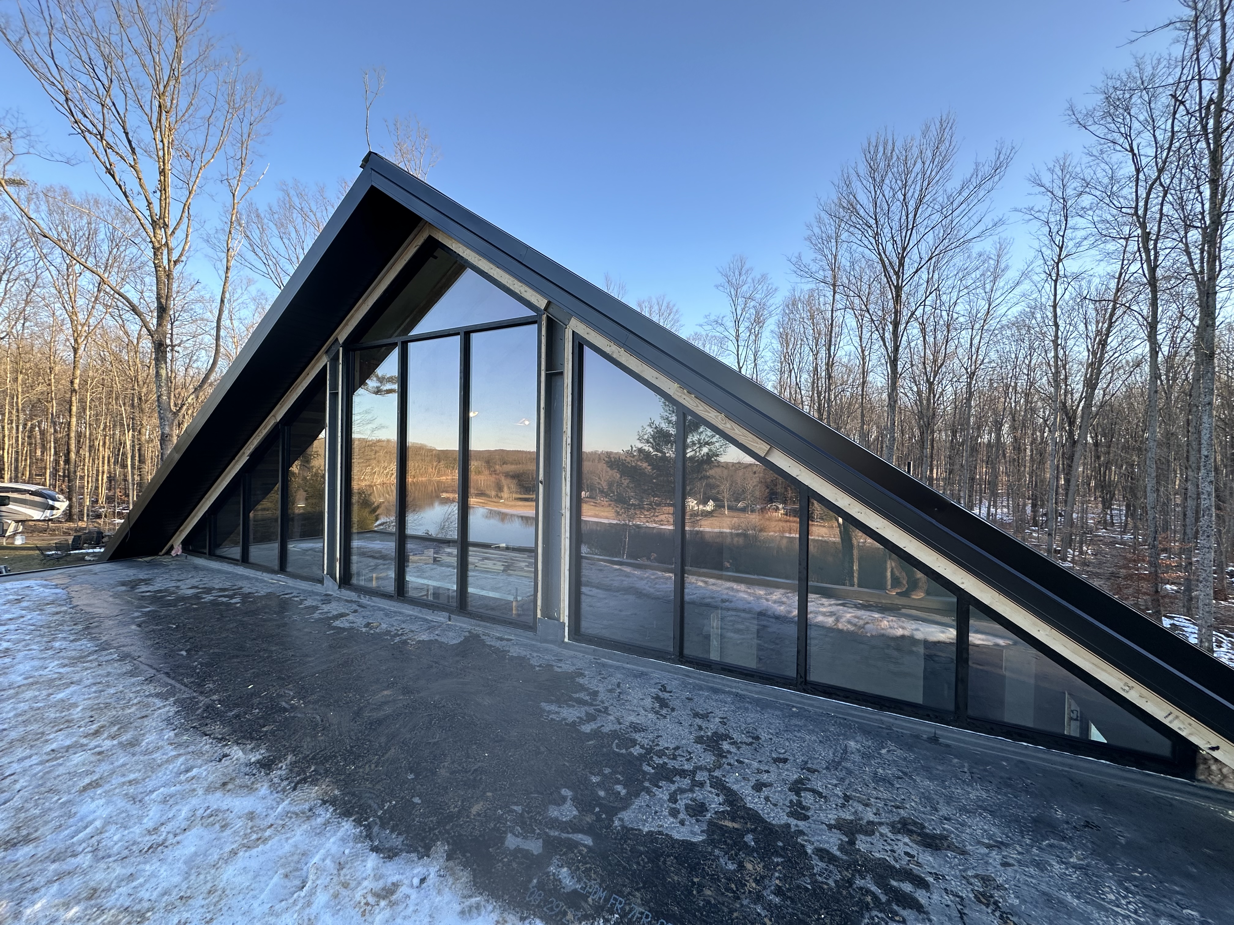 Custom A-frame residential glass wall installation West Michigan
