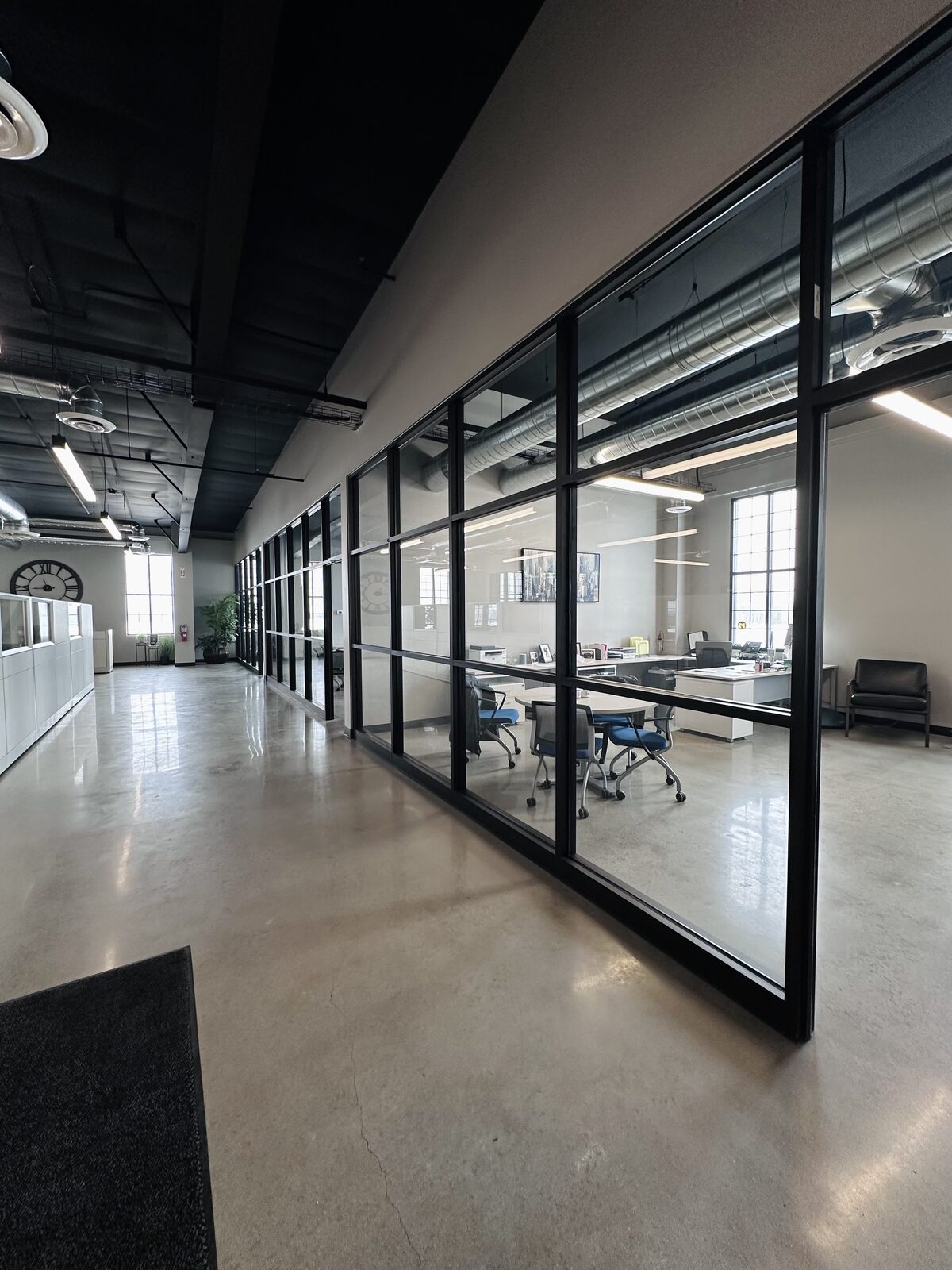Full-height interior glass partition installation commercial office Michigan