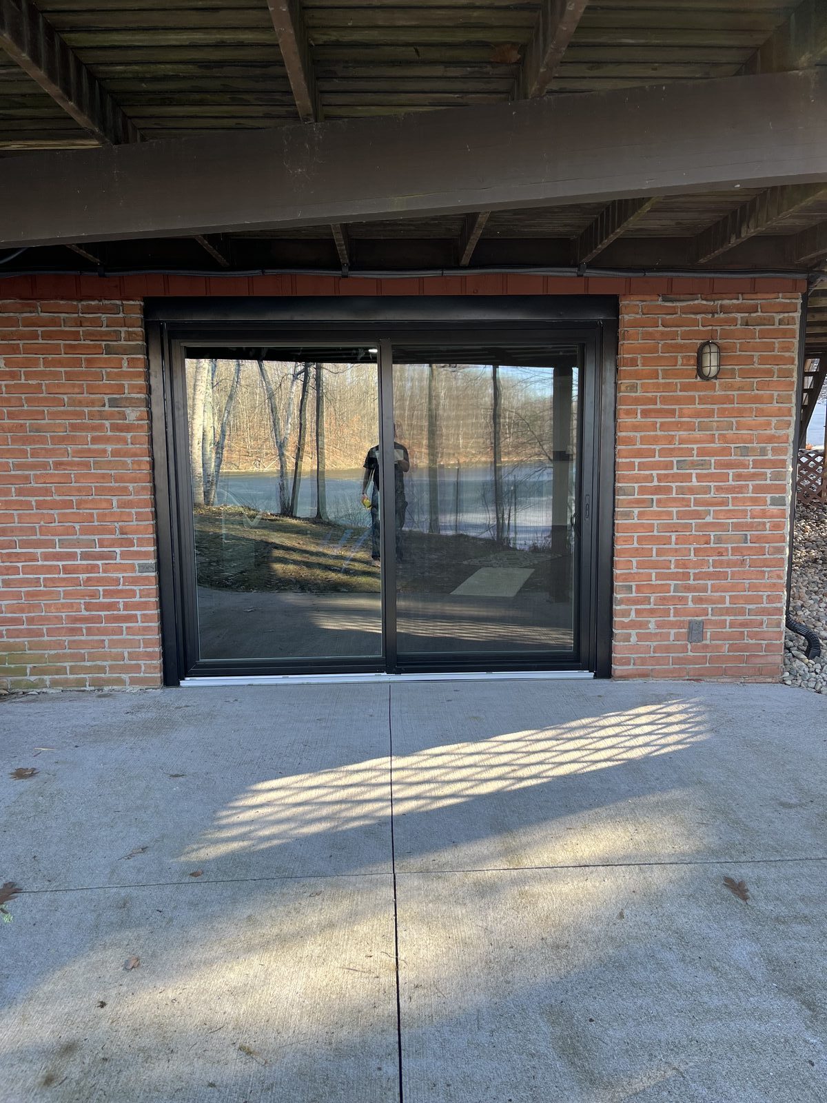 Residential sliding glass door installation in brick home West Michigan